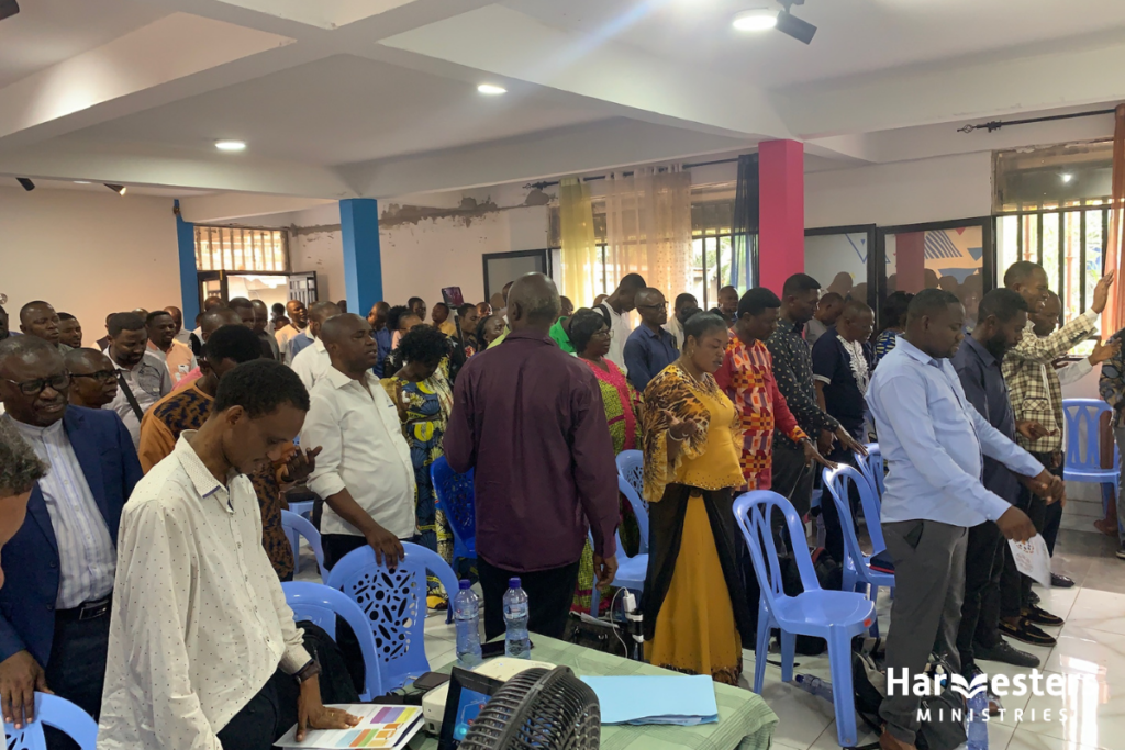 Pastors praying. Harvesters Ministries