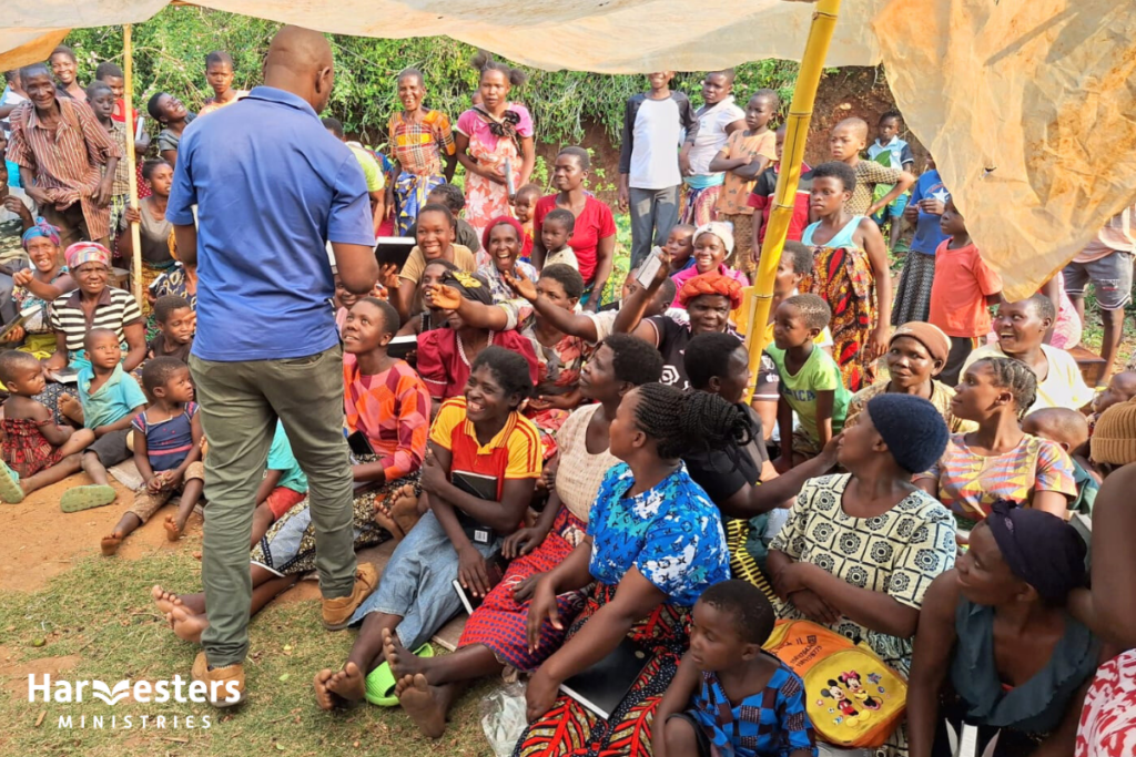 Handing out Bibles. Harvesters Ministries